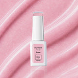 Flacon du vernis semi-permanent vegan 1944 Paris Ivana 7 ml sur fond rose pastel aux fines particules scintillantes.